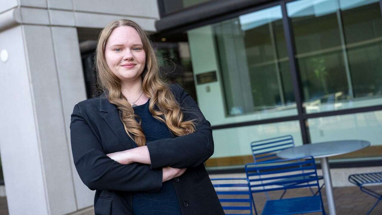 Headshot of Heather Mansfield outside, plays video